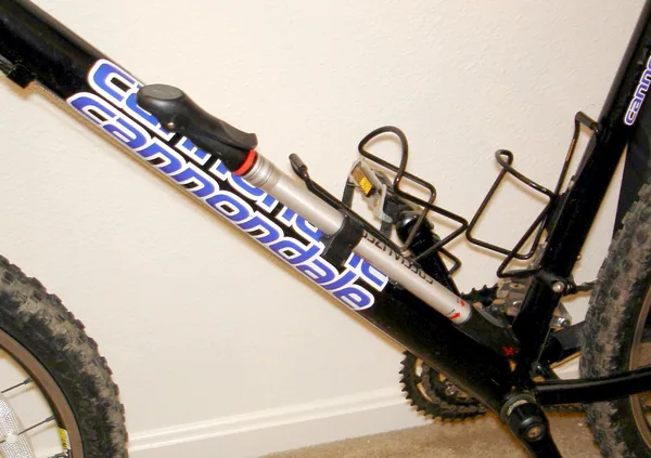 Frame-mounted bicycle pump